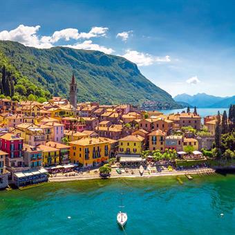 Aerial view of Varena on Lake Como with mountains, Italy