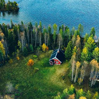 aerial view red cottage in forest finland