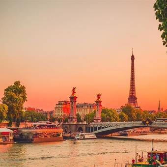 View of the River Seine at sunset with the Eiffel Tower in the background
